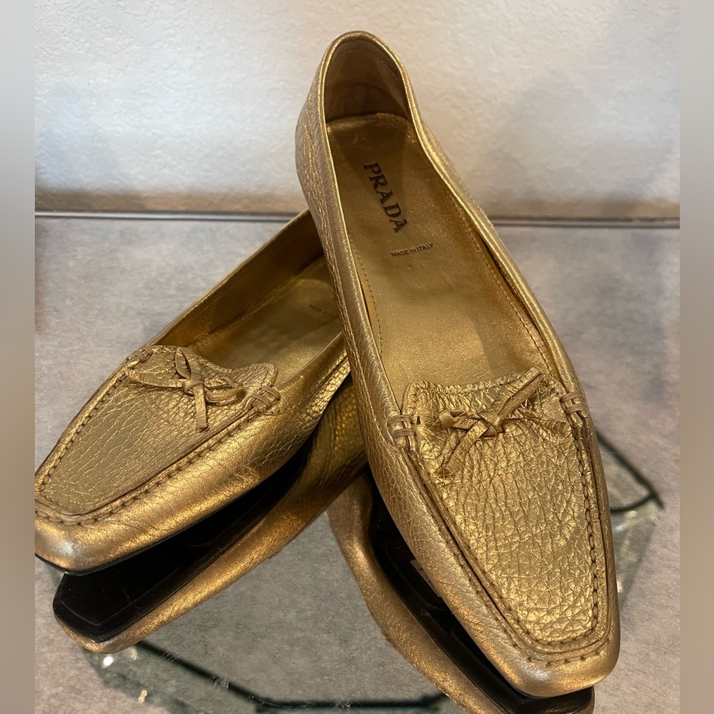 Prada gold leather loafers